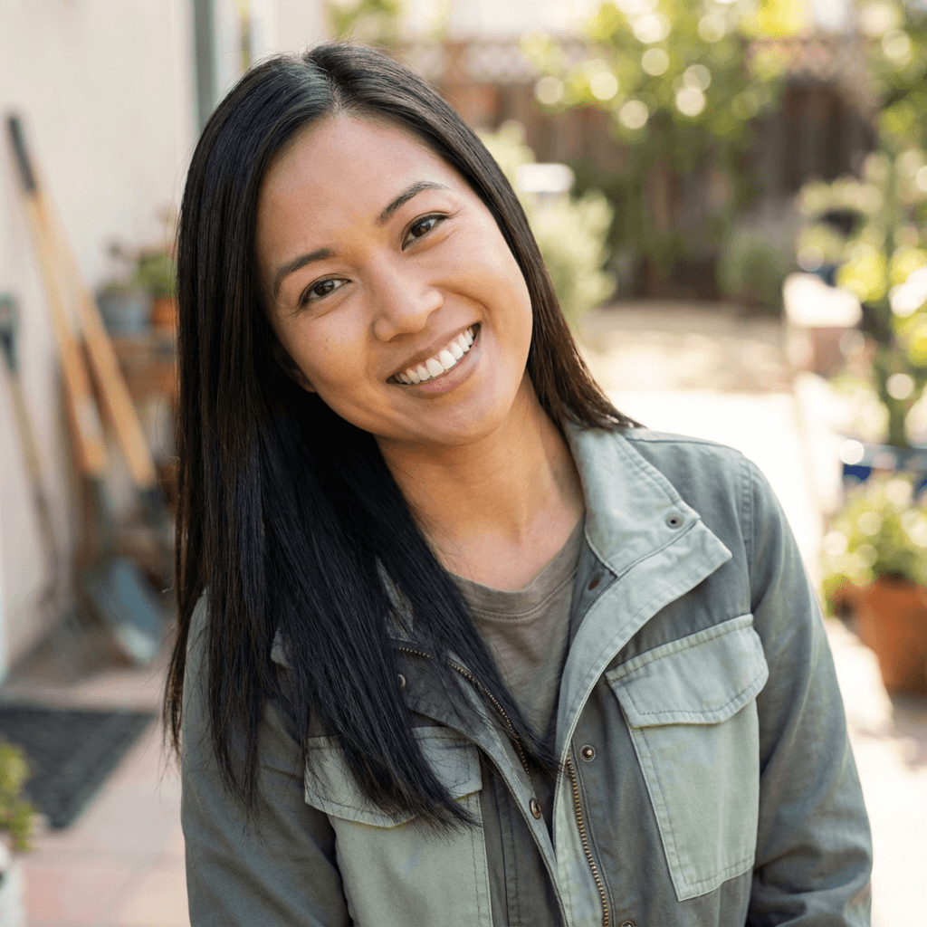 Female homeowner in her mid 40s, South Asian, composed and content expression typical of satisfied client